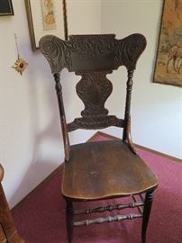 Carved wooden dining chair
