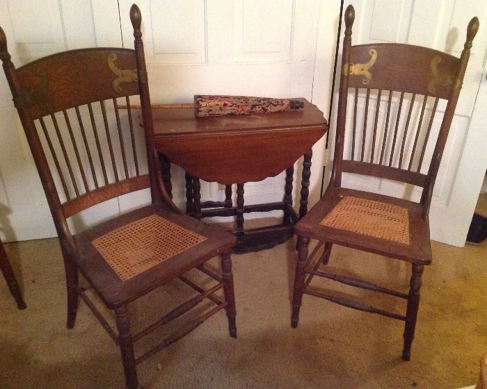 Old chairs, drop leaf table and decorative antique parasol