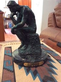 The thinker bronze on marble base