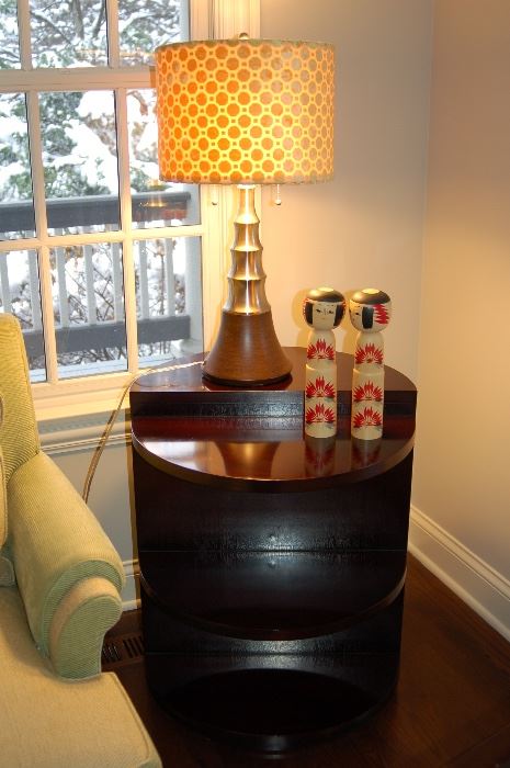 Round end table with shelves, contemporary lamp and asian deco