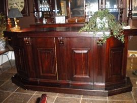 Antique/Vintage Tavern/pub bar....includes front and back bar with mirror and overhead for holding glasses and lighting. Overhead connects the front and back.