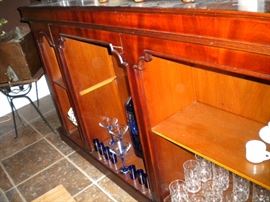 Antique/Vintage Tavern/pub bar....includes front and back bar with mirror and overhead for holding glasses and lighting. Overhead connects the front and back.