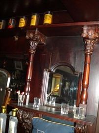 Antique/Vintage Tavern/pub bar....includes front and back bar with mirror and overhead for holding glasses and lighting. Overhead connects the front and back.