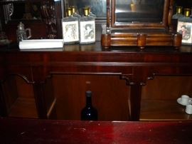 Antique bar....includes front and back bar with mirror and overhead for holding glasses and lighting. Overhead connects the front and back.