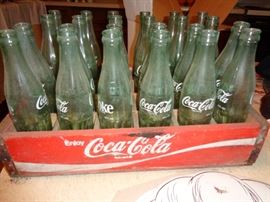 vintage coke cola bottles in wooden crate
