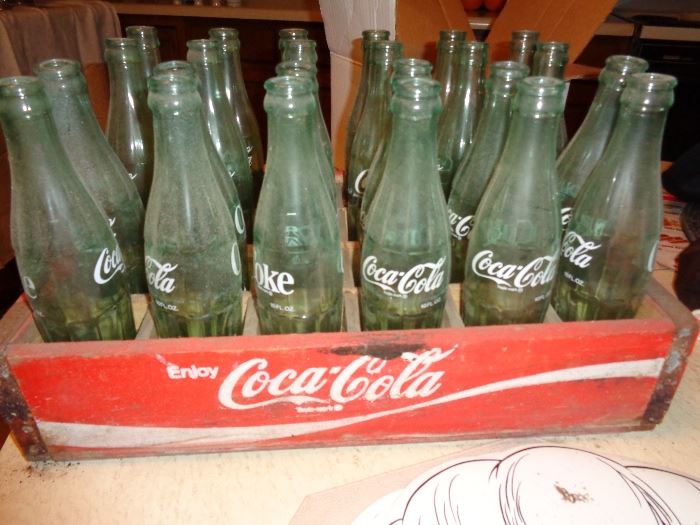vintage coke cola bottles in wooden crate