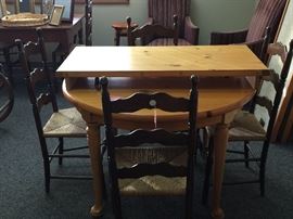 Pine table and ladder back rush chairs