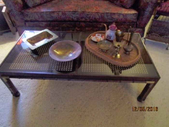 Coffee table; glass top; miscellaneous brass