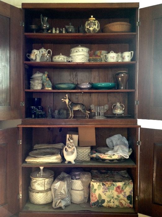 Turn of the Century Walnut China Cabinet filled with treasures including Van Briggle Pottery Lamp ,  old Wind up toy chicken, Old cast iron horse bank, Old Statue of Liberty Souvenir, Antique China set marked Germany
