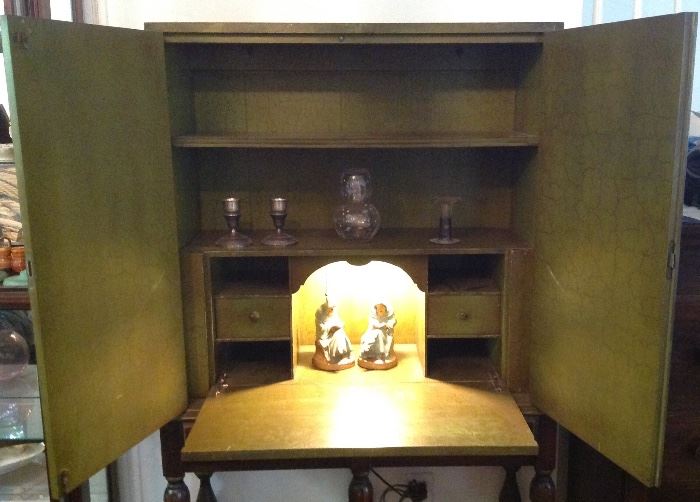 Inside of old lighted drop down table top secretary 