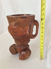 Large carved wooden pitcher. 