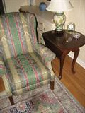Wing backed chair and end table with fold down leaves.
