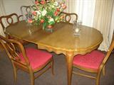 Maple dining table with six chairs also has matching hutch.