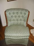 There are two of these occasional chairs with wood trim in blue/green fabric.