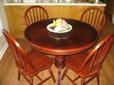 This excellent condition table is approxmiately 42" diameter with four chairs.