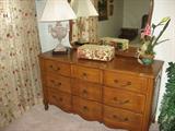 Maple dresser and mirror as part of great bedroom suite.