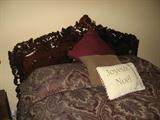 Queen Size Bed with mattress and Box Springs. Carved head and foot boards.