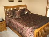 Queen Size Sleigh Bedroom Suite with dresser/mirror, chest of drawers and nite stand along with mattress and box springs.
