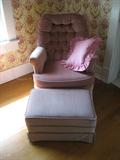 Mauve colored chair with foot stool to match