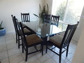 Glass dining table with marble base