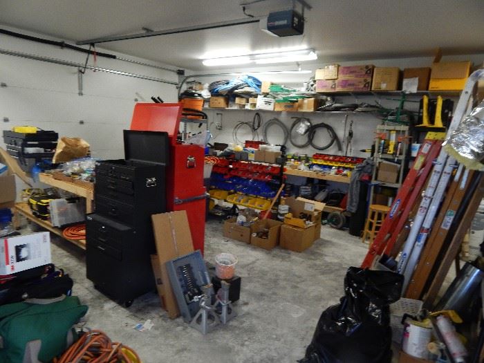 Garage full of tools, tool boxes, electricians supplies 