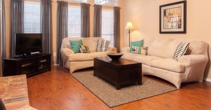 Plaid Sofa Loveseat set with neutral sofa covers: 2 looks for the price of 1. Flat screen tv media stand. Sony 32" tv