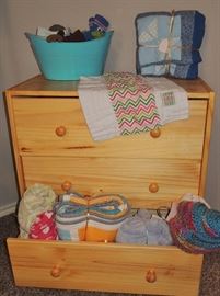 Small 3-drawer chest.  Many custom made quilts. Blankets, receiving blankets, baby blankets.