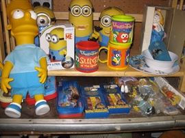 Interactive Minion dolls, Minion night light, porcelain Miss Piggy bank, Simpsons rubber action figures, Bart Simpson Dolls 1 large 1 small, Veggie Tales kitchenware, Frozen dinner set, Chicken Run utensil sets.