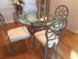 Metal Diningroom set 45" dia glass top ruffle edge top with 4 "Sunburst" back Chairs.                     $250.00set 
