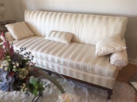Vintage carved base Sofa newly re-uphl in off white stripe Damask.                                             $395.00