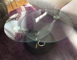 27 1/2" Round Glass Top Coffee Table swivels open to 47" double top on Black and Chrome base  $195.00