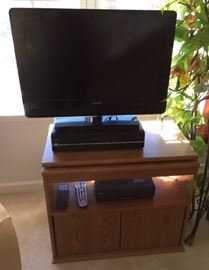 26" Bravia Flatscreen TV              $50.00   sits on Oak swivel top 2 door TV Cabinet 28" X 12"          $50.00