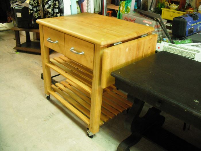 Oak butcher block cart with drop leaves and drawers on casters