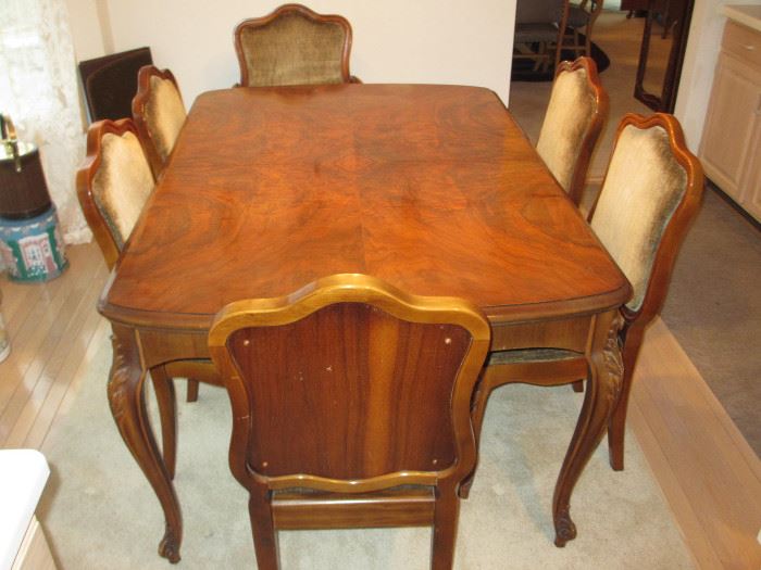 French country dining table and chairs with highly figurative maple and mahogany inlays