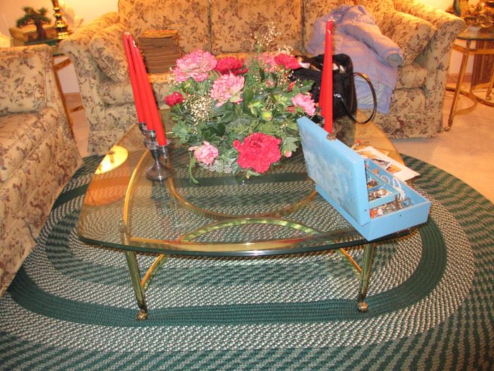 brass & glass table, hooked rug
