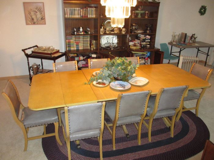 vintage dining table with leather clad chairs