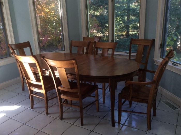 Stunning Stickley Dining Set with 8 Chairs and Extending Table. Table pads included. Table measures 85" long as shown (with one leaf) and 44" wide. Another 18" leaf not shown. 