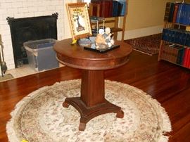 round pedestal table, framed original art, Oriental figurines.