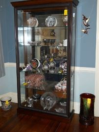 lighted curio cabinet, pottery umbrella stand, etc.