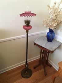 Antique brass and rose colored glass floor lamp