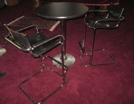 High quality hi top tables with chrome and leather chairs.