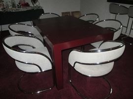 Burgundy laminate table with leaf sold separately.