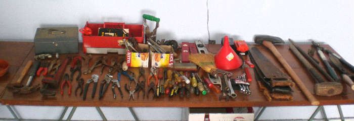 Assortment of hand tools and lawn and garden tools.
