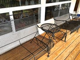 Outdoor patio loveseats, side tables.