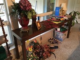 Long table, plants, holiday decor.