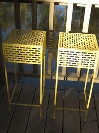 two metal yellow plant stands