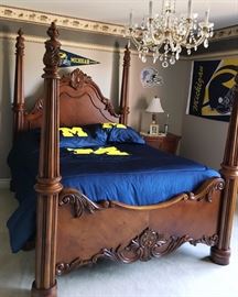 Lot#29, MODERN CARVED MAHOGANY FOUR POSTER BED AND CHEST, 2 PCS., H 85", W 67", L 82"Having fluted posts with carved acanthus leaf removable finials. Carved head and footboards with overall acanthus leaf designs. Also a chest having a bowed front with three full width drawers, columnar front corner posts. Carved contoured skirt with bun feet and brass pulls. See secondary photo for full view of chest.