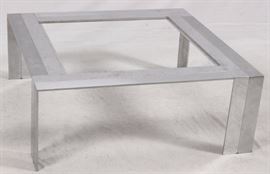 Lot#66, MID-CENTURY MODERN STEEL COFFEE TABLE, H 16", W 42", D 42"A square form stainless steel coffee table with a glass inset top. From the Estate of Daniel Clancy, Voltaire Place, Grosse Pointe Farms.