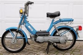 Lot#343, PIAGGIO VESPA, 'BRAVO', MOPED, 50CC, 1978, having light blue paint, head and tail light. Two leg kickstand. Serial number EEV1I 6064275. 'Bright Kawasaki' Lincoln Park, Mich. Label on top of the tank.