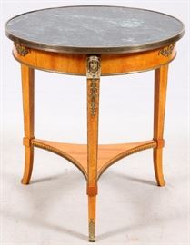 Lot#1029, JOHN WIDDICOMB GRAND RAPIDS, MI, MARBLE-TOP TABLE, H 30", DIA 26"Brass mounts. Egyptian motifs.  Circa 1940.